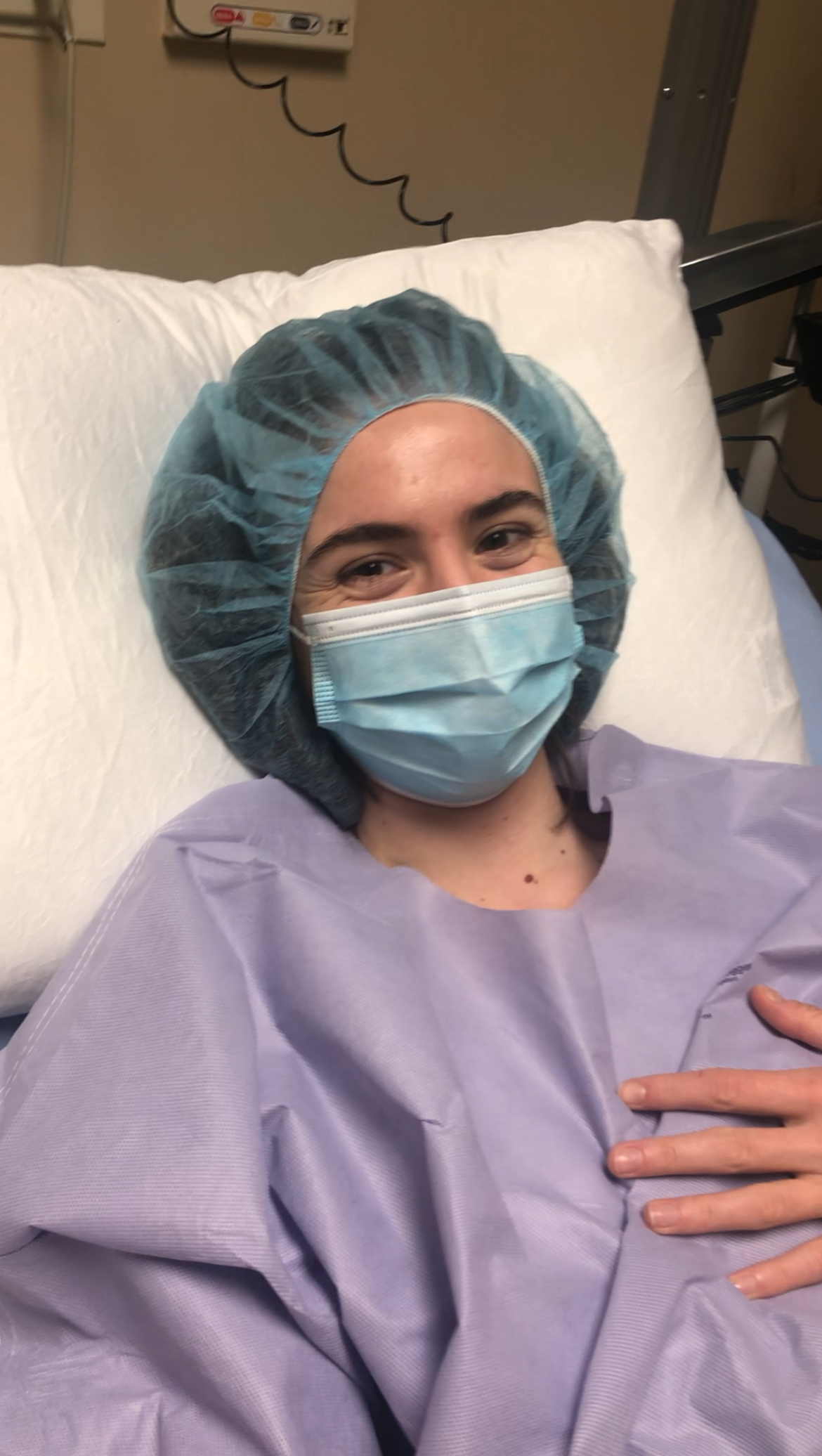 Nancy before surgery in hospital gown and cap